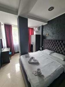 Postel nebo postele na pokoji v ubytování Hotel Fama