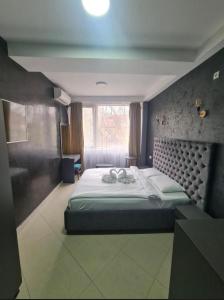 Postel nebo postele na pokoji v ubytování Hotel Fama