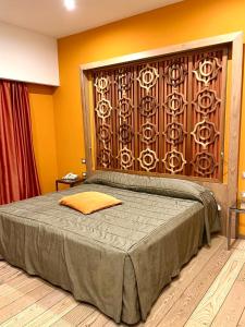 Una cama o camas en una habitación de Bouganville Hill Resort & Wellness Space