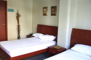 Uma cama ou camas num quarto em Hotel Onix Gold