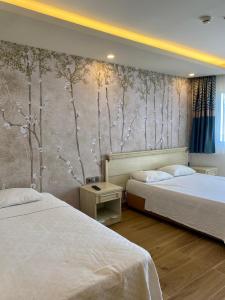 Postel nebo postele na pokoji v ubytování Hotel Mutlu