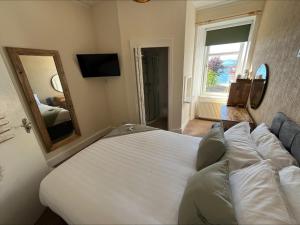 Voodi või voodid majutusasutuse Glenroy Guest House toas