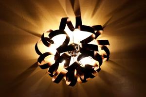 a chandelier is hanging on a wall at Peaceful Hub Saturnia in Manciano