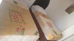 a bed with flowers painted on the side of it at Villa Silia in Sharm El Sheikh