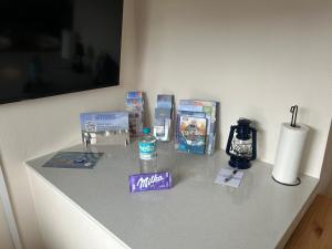a counter with items on it in a room at Ferienwohnung Ritthoff Perlebucht - mit Strandkorb am Meer und kostenloser Eintritt ins Schwimmbad in Büsum