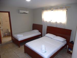 Uma cama ou camas num quarto em Hotel Onix Gold
