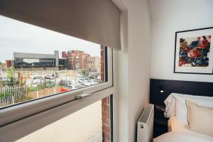 Ένα ή περισσότερα κρεβάτια σε δωμάτιο στο No46 Stylish City Studio Apartment, By DerBnB