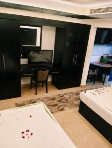 a bedroom with a desk and a bed and a desk at Villa Silia in Sharm El Sheikh