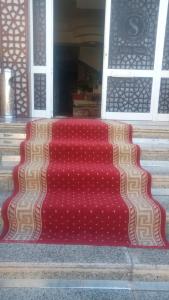 a red rug sitting in front of a door at Villa Silia in Sharm El Sheikh