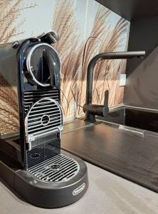 a toaster oven sitting on top of a kitchen counter at RegioStyle Apartment an der Müritz in Waren +2 photos
