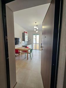 a room with a table and a dining room at Da Camilla in Cagliari +39 photos