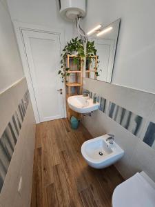 a bathroom with a sink and a toilet at Da Camilla in Cagliari
