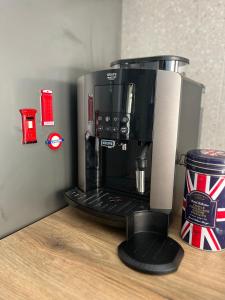 a coffee maker sitting on top of a counter at Piccadilly Apartment Patras in Patra +19 photos