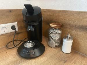 a coffee maker sitting on top of a counter at FeWo Günztalblick - Ruhige Lage -125 qm - neu und komfortabel - große Terrasse in Frickenhausen