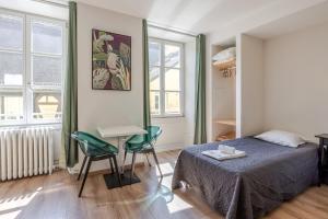 Postel nebo postele na pokoji v ubytování Hôtel Patricia - Strasbourg Hyper Centre