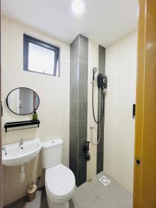 a bathroom with a toilet and a sink and a shower at Vista Bangi Muji-styled 3BR Sunrise view in Kajang +15 photos