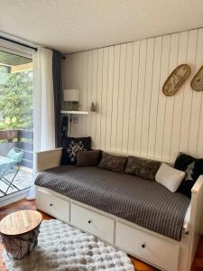 Posezení v ubytování Appartement 4 couchages avec terrasse