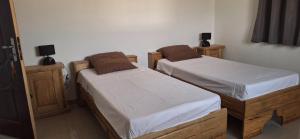 Ένα ή περισσότερα κρεβάτια σε δωμάτιο στο Villa à Malicounda 3 chambres, piscine, calme et confort à 10 min de Saly +32 φωτογραφίες