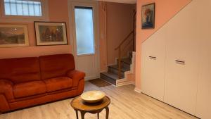 a living room with a couch and a table at les Marronniers in Vichy