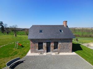 an aerial view of a brick house in a field at Gite de Marcel in La Huardière