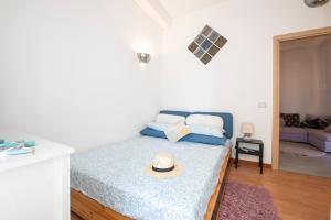 Ένα ή περισσότερα κρεβάτια σε δωμάτιο στο Casa Giada fronte mare a due passi da Roma