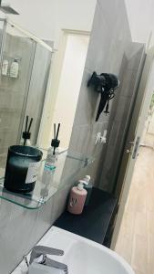 a bathroom with a sink and a mirror and a sink at Gevihome in Capua +83 photos