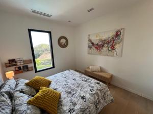 a bedroom with a bed and a window at Villa Les Jasmins - Le Cannet-Vallauris - Modern with AC, ideal for fun and work in Vallauris +56 photos