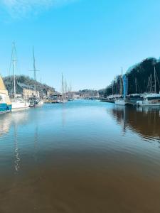 a large body of water with boats in it at La Maison Rouge sur le port à proximité de toutes commodités 2 personnes in Plérin