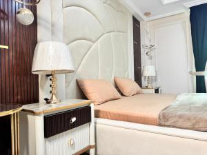 a bedroom with a bed and a table with a lamp at Bhurban Homes in Murree +9 photos