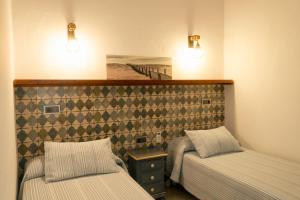 Postel nebo postele na pokoji v ubytování Montserrat Casa del Mar