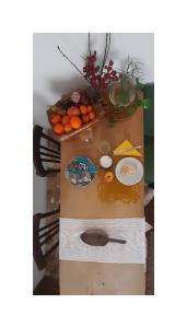 a table with oranges and other fruits on it at AB OvO in Cagliari +17 photos