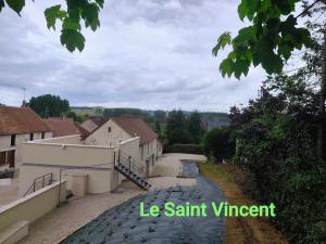 a view of a building and a road at Le Saint Vincent in Chablis +8 photos