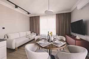 TV a/nebo společenská místnost v ubytování 2HomeRent Apartamenty Industria