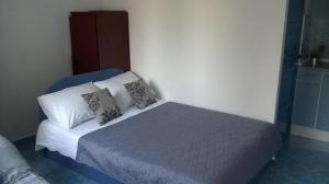 Postel nebo postele na pokoji v ubytování Apartments Dijan