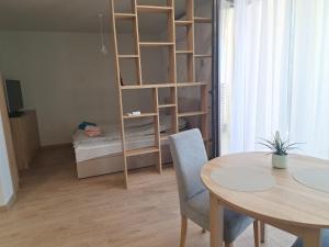 a small room with a table and a bunk bed at Skyline studio 44 in Varna City