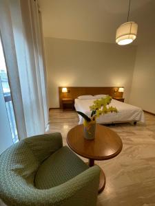 Postel nebo postele na pokoji v ubytování Hotel Clementi