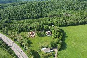an aerial view of a house in a field next to a road at Le Mont Poupet au domaine de Tara in LʼHôpital-du-Grosbois
