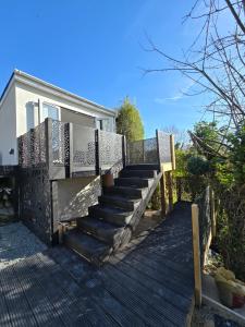 a set of stairs in front of a house at Treetops Studio Apartment in Penn