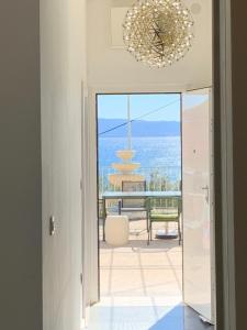 a view from the hallway of a house with a chandelier at Multiverse in Podstrana