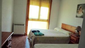 A bed or beds in a room at Casa Rural González Montsec Montrebei