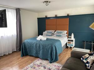 Ένα ή περισσότερα κρεβάτια σε δωμάτιο στο Riverbank Studios