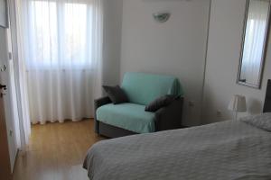 Ένα ή περισσότερα κρεβάτια σε δωμάτιο στο Apartment Vita Moela