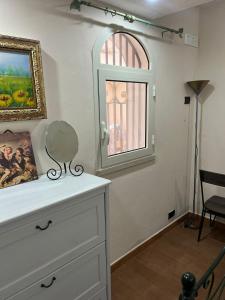 a room with a dresser and a window at Modica Blu Oceano in Modica +191 photos