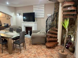 a living room with a table and a dining room at Modica Blu Oceano in Modica