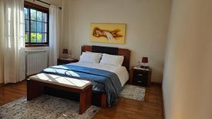 Postel nebo postele na pokoji v ubytování Suite em Viana do Castelo