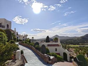arial view of a house with mountains in the background at Casa de Ensueño - exklusive Villa mit 3 Schlafzimmern, 3 Bädern, 4 Terrassen mit Panoramaausblick in Atamaría