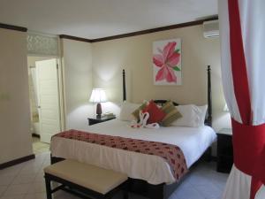 En eller flere senger på et rom på Franklyn D Resort & Spa All Inclusive