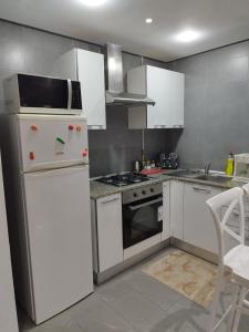 Kuchyň nebo kuchyňský kout v ubytování Appartement Cosy
