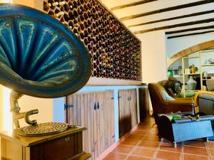 a room filled with lots of wine bottles at The Oak Tree Farm - Open Plan Layout by Portus Alacer in Rabaços