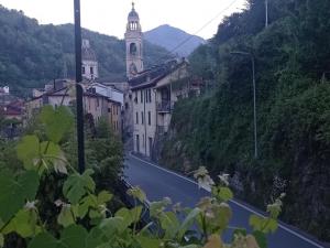 a town on a hill with a church and a street at C'era un Voltino Guest House in Borgonovo +24 photos